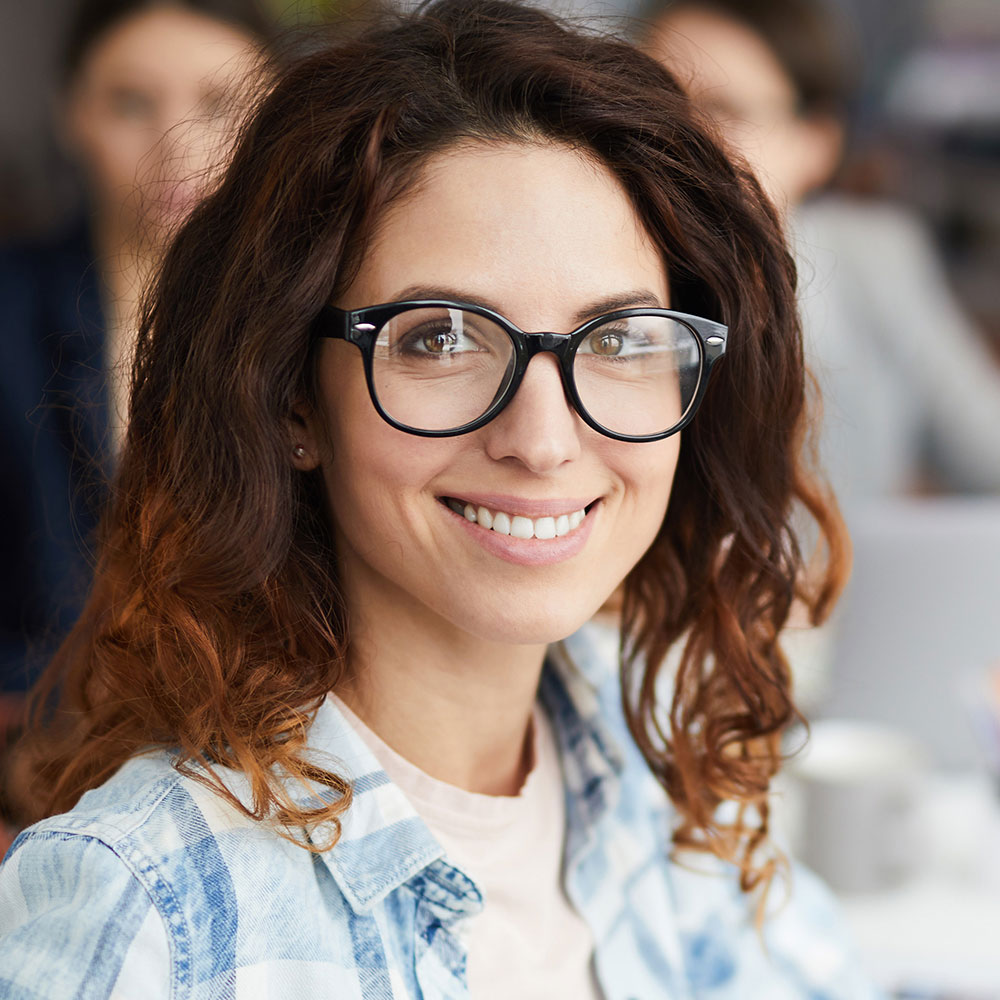 smiling-woman-in-business-meeting-8XM8MQA.jpg